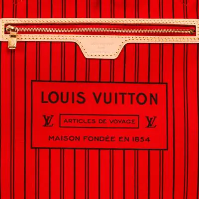 zip and the inside of a louis vuitton bag